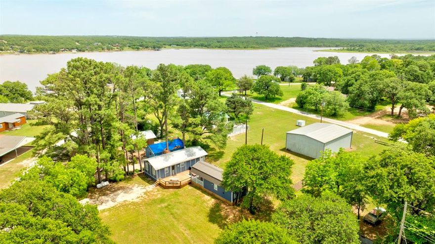 Imagine fantastic lake house getaways just moments from the shores of beautiful Nocona Lake! This charming property features a cabin and a fun bunkhouse, seamlessly connected by a wonderful deck, the perfect setting for creating lasting memories with loved ones. Offered fully furnished and ready for enjoyment, it's an effortless transition to lakeside relaxation. Plus, its design as a potential Airbnb makes it a brilliant investment opportunity in a highly sought-after location. It's more than just a place to stay, it's an experience waiting to happen. Say goodbye to setup hassles and hello to instant relaxation and memory-making with family and friends.