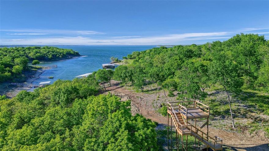 Welcome to the crown jewel of Thompson Heights! Lot 2A-1 offers 2.83 acres of pristine lakefront property with deeded ownership to the water's edge, a rare find on Lake Texoma. Enjoy two private 50-ft boat slips in a brand-new, fully equipped boathouse with water and power. This estate-sized lot provides endless possibilities for your custom lake home with panoramic views and total privacy. Located just minutes from Eisenhower State Park, marinas, and the highly anticipated Margaritaville!. Underground utilities and paved access already in place. Live lake life without compromise.
Highlights:
2.83 Acres
2 Deeded Boat Slips
Private, Build-Ready Estate Lot
Panoramic Lake Views
Paved Access + Electricity
Ownership to Shoreline (No Corps Buffer)
Call your favorite REALTOR® today!