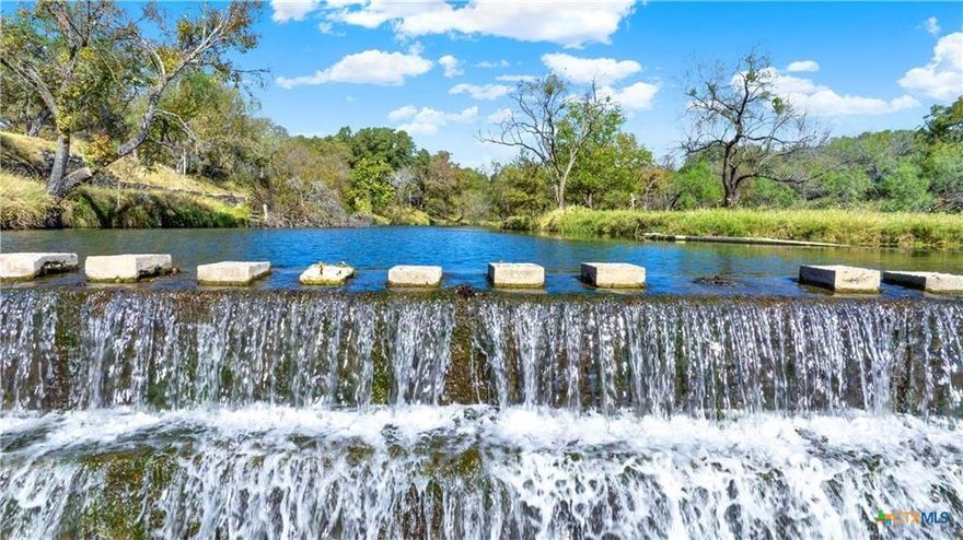 Horseshoe Falls, A Historical Lampasas Gem! Also known as Gunderland Park, a sprawling 378-ac high-fenced ranch. This is a very rare opportunity to own both sides of Sulphur Creek, as it flows year-round through the ranch. Be transformed to another world with the abundance of native tree cover, wildlife, and the sounds of living water. Adored by many, locals can recall fond childhood memories of fishing and camping here. An original merry-go-round and hand-built rock BBQ pits, benches, and tables still remain intact. An upper pasture blooms with sunflowers, attracting quail hunting enthusiasts. Most recently, this one-of-a-kind property is being used as an exotic ranch, serving guests with exclusive hunts and catered private events. The ranch's centerpiece is a spacious 2,500+ sq ft 1.5-story primary home with 4 bedrooms, 2 bathrooms, and two living areas, offering breathtaking views and sounds of the ever-flowing Sulphur Creek dam. This site holds important significance as Captain J.F. Brannon of the Ninth Infantry commissioned 193 men to build the Lampasas State Park & Dam in June 1933. Beyond the main residence, discover a 2400 sq ft., climate-controlled main hall overlooking the live water of Sulphur Creek, equipped with restrooms and a rustic rock fireplace upon entry. Perfect for weddings, private or corporate events, or private family get-togethers. Capable of seating up to 150 people comfortably around dining tables, with additional seating outside on the rock patio. Additionally, there are six fully restored and uniquely decorated cabins. All with unique themed decor with names such as: The Ranger Station, Bass Bungalow, Birds Nest, Tee Pee, La Cabana & of course, the JAIL. Most cabins sleep 2-6 guests with full bathrooms.  A Lodge, aka The Horn Room is equipped with a full kitchen for serving a larger party of guests at once. Enjoy a game of pool or darts in the game room. Pictures and words cannot adequately describe this unique paradise.