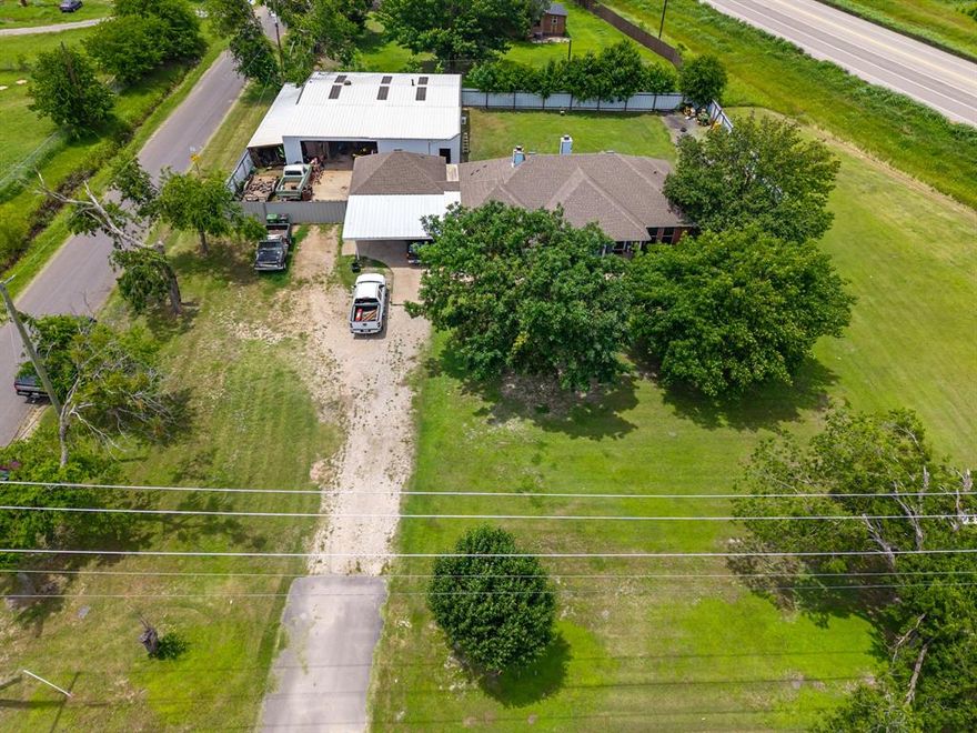 Versatile Home with Income Potential in a Rapidly Growing Area

This unique property offers the perfect blend of residential comfort and investment opportunity, located on a high-visibility corner lot just off the Loop 9 frontage road. 

The main home offers 1,785 square feet of living space and can easily be adapted to suit your needs—whether as a spacious single-family residence or converted into a home-based business or multi-suite setup. A detached 20x21 studio with a kitchenette provides additional flexibility, ideal for guests, a private workspace, or rental income. For those needing extra room, a large 50x50 metal garage-workshop adds and additional 3076 sq. ft & includes a second-floor loft for storage or expansion, while a 12x50 covered area behind a secure metal fence offers further space for parking, hobbies, or storage.
Currently used as a residence and zoned for both residential and commercial use, this property offers endless potential to live, work, or invest—all on one lot. With excellent accessibility, plenty of room to grow, and exciting development happening all around, this is a must-see for buyers looking to secure a home with built-in value.