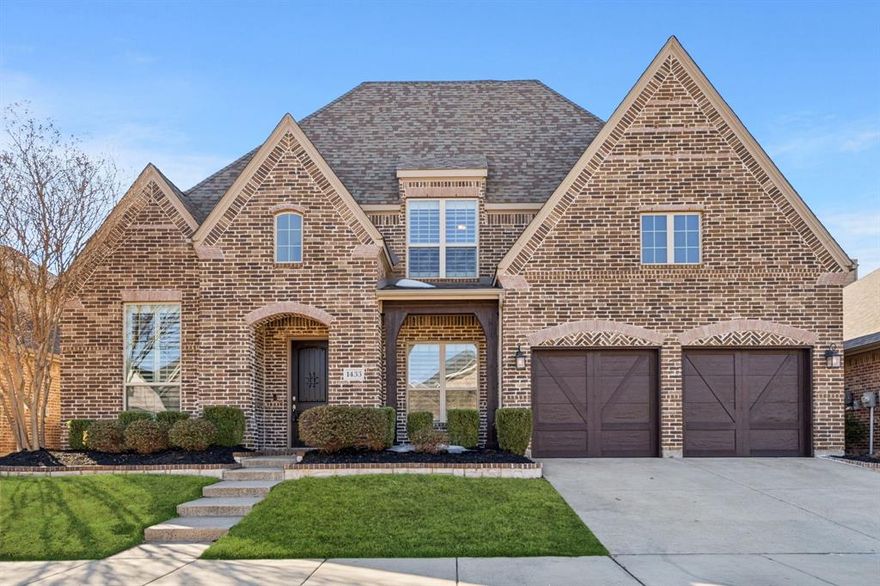 Welcome home to this stunning Highland-built, two-story brick beauty in the highly sought-after Harvest community of Argyle, TX. From the inviting front porch and front-entry 3-car tandem garage to the elegant foyer with decorative lighting and rich hardwood floors, this home is packed with thoughtful details. The open-concept living area features a vaulted ceiling, stone fireplace, ceiling fan, built-in desk, and beautiful views of the backyard, creating a warm and welcoming space for everyday living and entertaining. The private front office showcases built-in shelving and French doors, perfect for working from home. The chef’s kitchen is a showstopper with a gas cooktop, double ovens, farmhouse sink, quartz countertops, white cabinetry with select glass-front cabinets, a large island, and a built-in wine refrigerator. The breakfast nook offers easy access to the backyard, ideal for indoor-outdoor living. The spacious primary suite is located downstairs and includes a cozy sitting area, soaking tub, separate shower, and an oversized walk-in closet. A secondary bedroom with a walk-in closet is also conveniently located on the main level. Upstairs, enjoy a large loft or family room, media room, a bedroom with ensuite bath and walk-in closet, plus two additional bedrooms—all with walk-in closets. The backyard features a wood fence, covered patio, and plenty of space for a future pool and play area. Residents of Harvest enjoy incredible amenities including multiple community pools, playgrounds, clubhouse, fitness center, jogging paths, community garden, and the charming Coffee Farmhouse. This home truly offers the perfect blend of comfort, style, and community living.