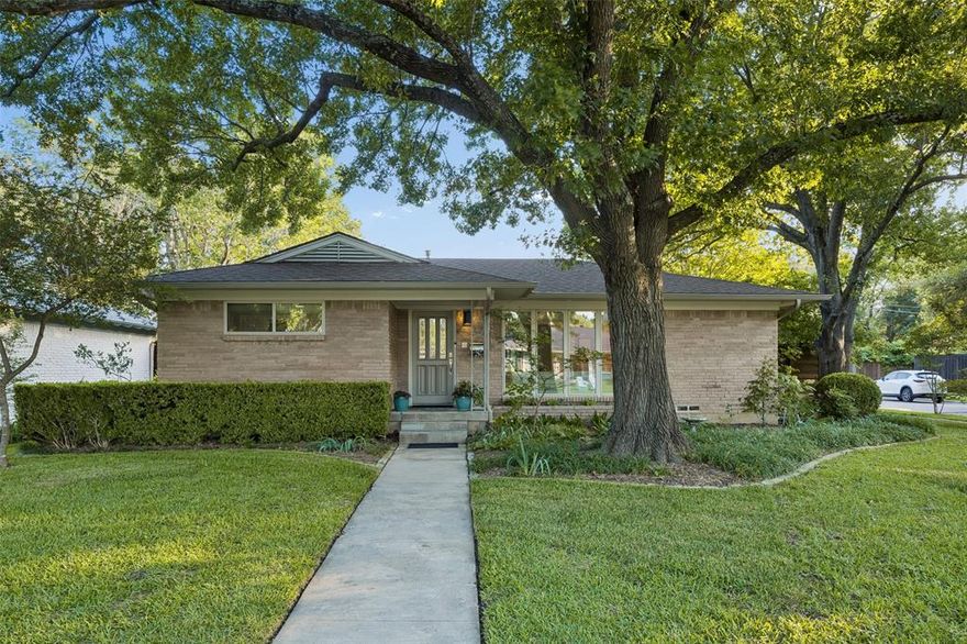 Located on an large corner lot in the sought-after L Streets of Lake Highlands & zoned to RISD, 8871 Liptonshire is a picture-perfect 1950s ranch with mature trees, lush landscaping & incredible curb appeal.

Inside, natural light pours through updated windows, giving the home an airy, inviting feel. Featuring 3 generous sized beds, 2 baths & a flexible semi-open floor plan, this home offers the perfect mix of character & functionality. One of the secondary bedrooms also works great as a flex room, office, playroom, or second living area.

Original hardwoods run throughout the living and bedrooms, while the kitchen features modern cabinetry, great storage & direct access to the breakfast area, laundry room, backyard & pool area. The whole-house central vacuum system with multiple plug-ins is one of those upgrades you don’t realize how much you’ll love until you have it.

But the real magic happens out back.
Step outside to a fully screened-in covered patio overlooking the swimming pool with gas heater — perfect for enjoying the outdoor space year-round while keeping mosquitoes & pests away. Beyond the enclosure is a large backyard with mature trees, green space, an 8-foot top notch tongue & groove cedar fence for true privacy, plus a side-entry garage & solar powered gate — creating a private oasis tucked away in the heart of Lake Highlands.