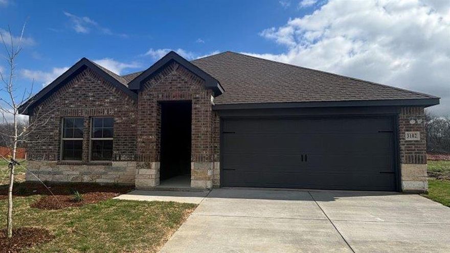 Four bed, two bath, two car garage with open concept, island in the kitchen with walk in pantry. Base level quartz in the kitchen with stainless steel microwave, dishwasher and oven.
