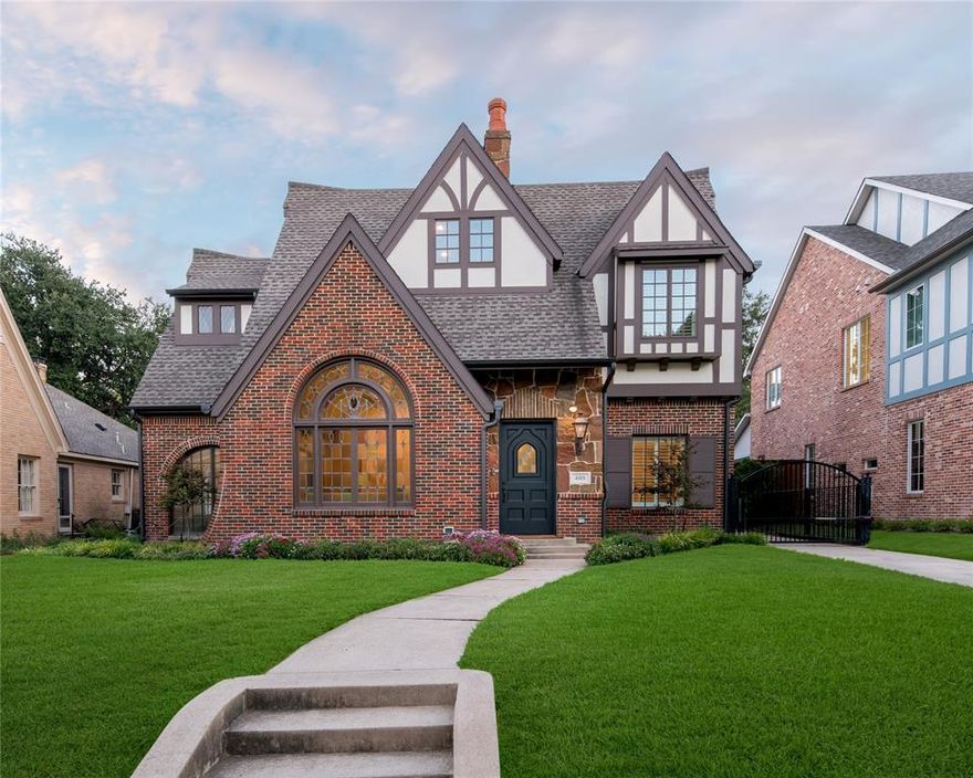 Situated in Highland Park on the French Streets & gracefully expanded & remodeled by Ellen Grasso, this architecturally significant 1929 Tudor showplace is steps from Flippen Park & near Highland Park Village & Bradfield Elementary. Blending timeless elegance, impeccable chic interiors & state-of-the-art amenities, the transitional home's leaded glass windows, arched entries & vaulted beamed ceilings are just a few special treats. From the Thermador appliances in the white marble island kitchen open to the family room & breakfast area to the highlighted 13ft vaulted living room to relaxing in the game room, this home has it all. The upstairs primary suite is luxurious with its 11ft beamed ceiling, spa-like marble bath & room-size closet. Boasting 4 secondary bedrooms & stylish ensuite baths, don't miss the downstairs guest suite & chic office. Entertaining is effortless with its covered terrace & patio with outdoor kitchen-all overlooking a lush landscaped backyard & 2-car HVAC garage.