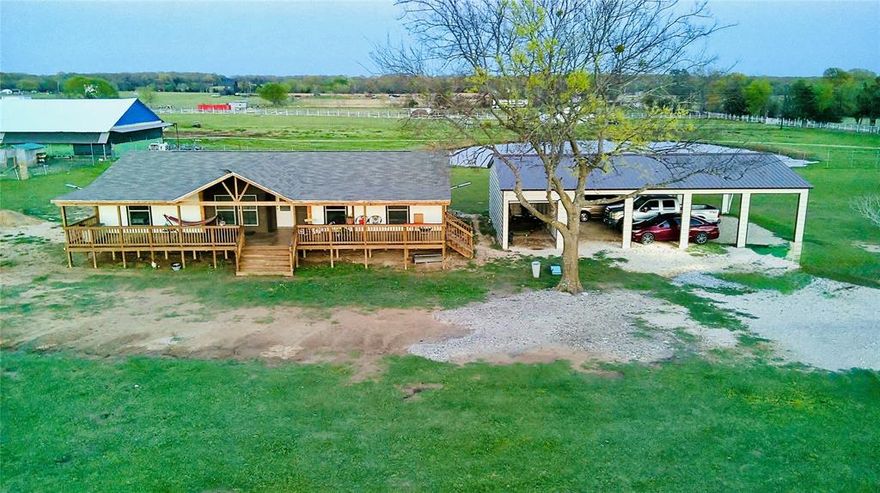 This beautiful property offers over 5 acres of and is fully fenced with a front electric gate for added privacy and security. Conveniently located with easy access to Highway 20, this property combines peaceful country living with accessibility. The home features a brand new 2025 doublewide with 4 bedrooms and 2 baths, designed with comfort and space in mind. Enjoy relaxing mornings or evenings on the large front porch, the perfect spot to sit back and enjoy your coffee while taking in the open views. Additional features include a new septic system installed in 2025 and a large carport that accommodates up 4 vehicles measuring 30 X 50. A unique BONUS to this property is the barndominium structure already started with a pier and beam foundation in place. Bring your vision and plans to a complete it-offering the possibility of two homes on the property for extended family, rental income, or guest space. 
NO HOA! and no unknown restrictions, giving you flexibility to make this property your own Come see the potential this property has to offer-
Your next home could be waiting here!