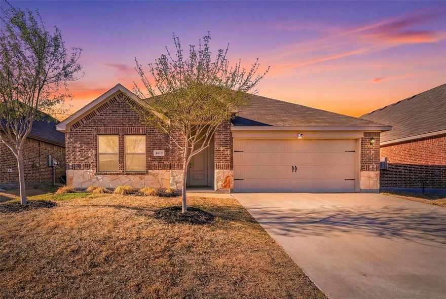 Welcome to 1012 Grand View Drive in Ennis where comfort space and modern style come together in a beautifully maintained home designed for everyday living and effortless entertaining. From the moment you step inside you are greeted by an inviting layout filled with natural light and thoughtfully designed living spaces. The open concept main living area creates a seamless flow between the kitchen dining and family room making it ideal for gatherings holidays or quiet evenings at home. The kitchen serves as the heart of the home featuring abundant cabinetry generous counter space and a functional layout that keeps you connected to the living area. Whether hosting guests or preparing weeknight meals this space offers both style and practicality. The private primary suite provides a relaxing retreat with a spacious bedroom and well appointed bath designed for comfort. Secondary bedrooms offer flexibility for family guests or a home office. Step outside to a spacious backyard ready for entertaining pets play or future customization. There is plenty of room to create your dream patio pool or garden oasis. Located in a desirable Ennis neighborhood with convenient access to local schools shopping dining and major highways this home offers the perfect blend of small town charm and everyday convenience. If you are looking for a move in ready home with a functional layout and room to grow 1012 Grand View Drive is a must see.