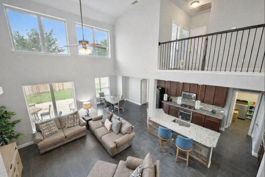 PRICE DECREASED! Welcome to your private retreat in the highly sought-after TRINITY FALLS master-planned community in McKinney. This beautifully maintained 4-bedroom, 2.5-bath home offers a bright, open-concept design enhanced by custom designer lighting and a wood-accented kitchen island; that adds warmth and character. The flexible downstairs layout includes a spacious flex room—ideal as a home office or easily convertible to a fourth bedroom, to suit your lifestyle—while the kitchen opens seamlessly to a breakfast bar and oversized dining area, creating the perfect setting for entertaining and everyday living. Upstairs, enjoy a generous game room along with two well-appointed guest bedrooms that share a full bath with dual sinks, plus a large walk-in attic providing exceptional storage space, rarely found in comparable homes. Step outside to a charming covered front porch and an extended back patio with a NEW pergola; already equipped with gas and water lines—ready for your future outdoor kitchen and backyard oasis. Nestled within a vibrant community near parks, scenic hike-and-bike trails, stocked fishing ponds, 21-hole disc golf, resort-style pools, a modern fitness center, and year-round neighborhood events. Traffic is shifting to major thoroughfares from FM 543 to State Highway 5, which is being rebuilt into a four-lane divided roadway, with construction phases continuing through 2026–2027 to improve traffic flow. Future growth including the McKinney Airport expansion, Sunset Amphitheater, water parks and everything the City of McKinney has to offer!