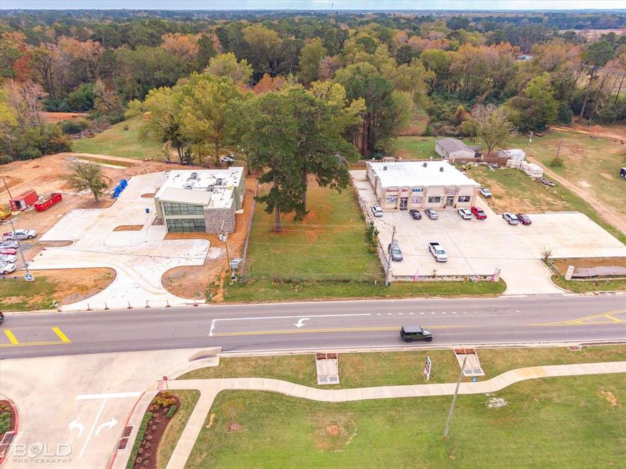 Nearly half acre lot ready to be developed! High traffic area with 84' of road frontage. Directly across from Kroger, sitting atop the hill and just a stone's throw from multiple restaurants, businesses, and the upcoming pickle ball arena.