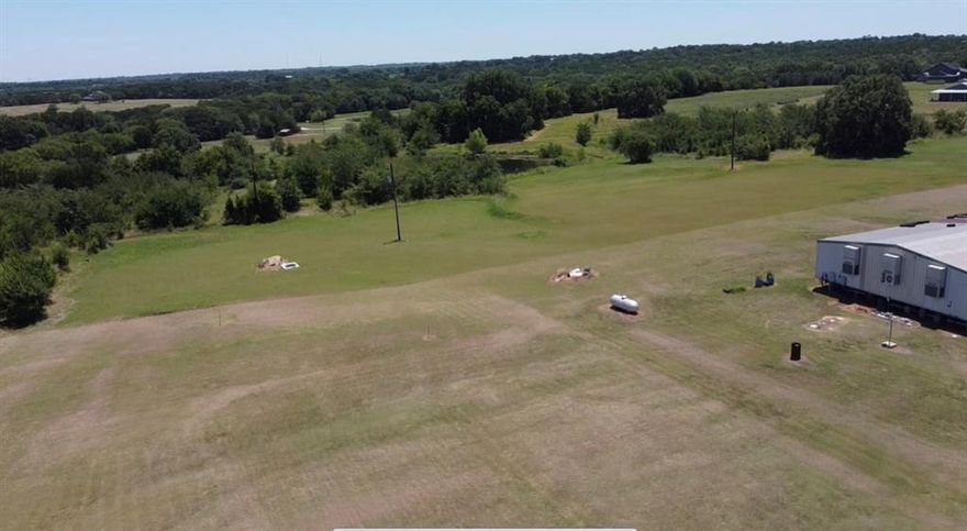 21.5 Acres – Prime Development Opportunity in Bells, TX
Located at 122 Roy Ayers Rd, this 21.5± acre tract offers exceptional development potential with approximately 1,350 feet of frontage on Hwy 56 and 500 feet on Roy Ayers Rd. A picturesque pond sits near the center of the property, adding natural appeal and value. Pink Hill Water has an established well on the northwest corner with meters available, making utilities easily accessible. With its dual road frontage, water access, and location just minutes from town, this property is ideal for residential development or a private estate.