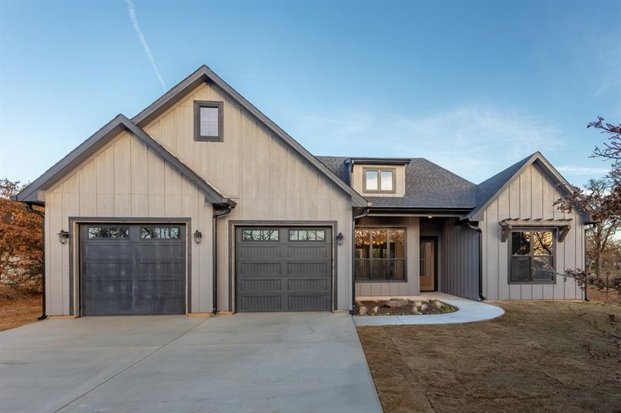 The spring market brings this fabulous new construction modern farmhouse home located on a treed 1-acre lot in the quiet and charming area of Cooke County! This home features a 4 BR 3 BA split floor plan with room to roam outdoors! The living room features cathedral ceilings, gas fireplace with antique headboard, and gorgeous views of the back of the property. Kitchen has gas range, quartz countertops, island, an abundance of cabinets, walk-in pantry, apron front farm sink, refrigerator, lots of natural light and is open to the living area! The dining room is also open to the living area and features a dry bar. The stunning primary bedroom and bath features a massive shower with dual shower heads and custom tile work, separate soaking tub, dual vanities, sitting area, extra cabinet and storage space, and an oversized walk-in closet! No shortage of upgrades on this house: Pella windows, tankless hot water heater, luxury vinyl plank and custom tile flooring, tall ceilings, spray foam insulation, 2x6 exterior walls, storage in the garage, and storage closet at the rear exterior. Covered patio is the perfect place to relax and features an outdoor fireplace and is plumbed for gas and water for an outdoor kitchen area. The land is absolutely phenomenal and the perfect place to have a garden, chickens, livestock, horses, homestead, and so much more! No HOA: freedom to make this place yours! The property features mature oak trees and cedar trees and is quiet, serene, and peaceful. Listen to the birds chirp, the crickets sing, and the leaves rustle as you retreat and relax! If you need to get out and shop or need to commute the property is in close proximity to Hwy 82 and Hwy 377, making it easy to get anywhere. Don't miss this fabulous opportunity to live on a beautiful North Texas property in an amazing new home!