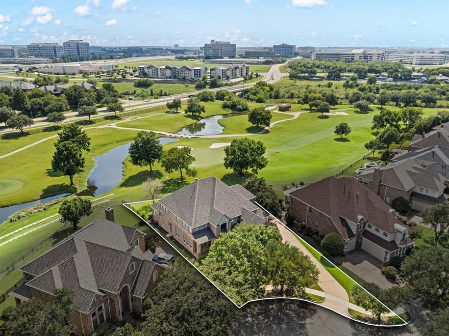 Welcome to this exquisite property! Nestled inside the guard-gated Hackberry Creek community, you will enjoy the picturesque view of the hole one green of the Byron Nelson designed course within Las Colinas.Tucked away on a pie shaped lot, the stone and brick facade, combined with the meticulously manicured landscape and brand new roof, create the ideal curb appeal. Upon entry, you are greeted by hand-scraped wood floors that cover the entire main level. From the foyer there are sight lines through the main living room, complete with gas fireplace and a custom wood wall, straight through the back yard and onto the first green. The entry is flanked by a formal living space overlooking the large covered front porch. Just across the entry is a formal dining room perfect for hosting large groups.The open concept kitchen serves as the perfect place for intimate family dinners or entertaining friends and family. A full sized, stainless steel, built-in refrigerator, gas cooktop, and sprawling counter space make this area fitting for even the most demanding of chefs. Just past the executive office with bold built ins, the primary suite, with bay windows overlooking the back yard and golf course, is intimate and impressive with a well maintained ensuite bath and substantial walk-in closet. The spiraling wood staircase leads to four additional bedrooms, two with ensuite baths, one of which serves as s second primary and has direct access to a covered patio. The 2nd level game room is flexible to meet anyone's needs and desires. From media to music room to billiards, the possibilities go on and on. The backyard is where the real fun happens. The wrap around porch allows you to take in relaxing sunsets as you watch golfers stroll by. The large, open yard provides an ideal space for play, entertainment, or that awe-inspiring pool you've always dreamed of.