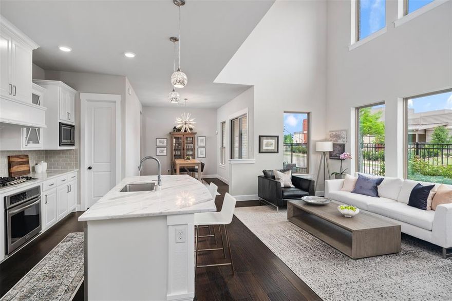 Situated in the coveted Spicewood at Craig Ranch and zoned to acclaimed Allen ISD, this stunning two-story residence offers a refined blend of luxury, comfort, and convenience—just moments from Hwy 121, scenic trails, parks, and a nearby dog park.

Inside, elevated finishes and thoughtful design define the open-concept layout, featuring engineered hardwoods throughout the entry, office, kitchen, and breakfast area, complemented by extensive millwork, custom door casing, and designer lighting. A sophisticated front study with French doors offers the perfect work-from-home space or elegant dining option. The inviting living area is anchored by a striking stone fireplace with electric starter, creating a warm yet modern focal point for entertaining. 

The gourmet kitchen is both functional and beautiful, showcasing quartzite countertops, crisp white cabinetry, sleek silver hardware, subway tile backsplash, Frigidaire five-burner gas range with oven, built-in microwave, walk-in pantry, and included refrigerator. The adjacent dining area flows seamlessly for effortless hosting.  

Upstairs, hardwood stairs lead to a spacious loft or game room with ceiling fan, a versatile secondary office or flex room, and a well-appointed laundry room complete with newer LG washer and dryer, plus drip-dry space. The private primary suite offers a serene retreat with a spa-inspired bath featuring quartzite countertops, dual vanities, framed mirrors, updated lighting, white cabinetry, and a beautifully finished shower with quartzite surround and black framing. A generous walk-in closet completes the suite.

Updated guest bath has quartzite counters, designer finishes, and a tub and shower combination. Additional highlights include a stylish powder bath, abundant storage including a spacious under-stair closet, ceiling fans throughout, and timeless, high-end finishes at every turn. Fabulous landscaping on side-back yard creates a relaxing and beautiful space.