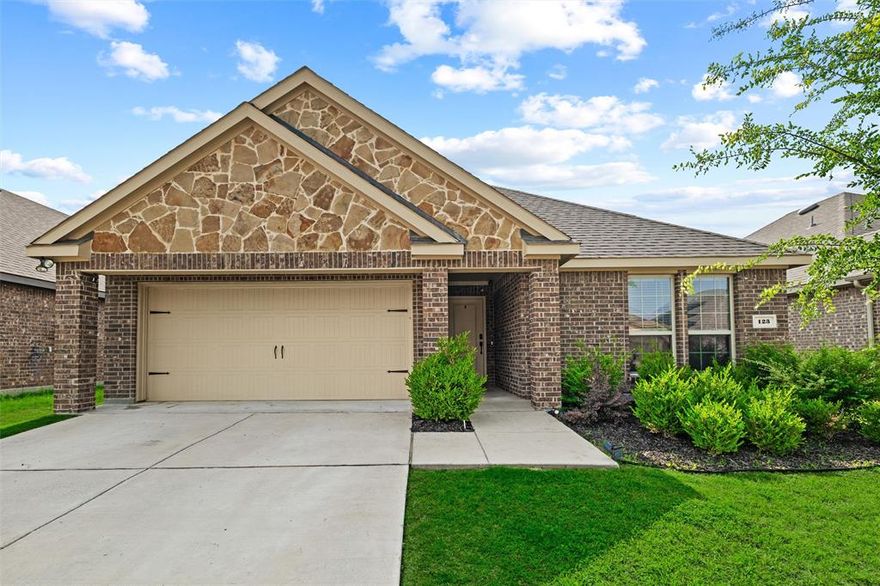 Bright, inviting, and thoughtfully designed, this beautifully maintained home in the heart of Waxahachie offers the perfect blend of comfort and style. The open-concept layout features spacious living and dining areas filled with natural light, durable wood-look flooring, and a crisp modern color palette throughout. The kitchen shines with granite countertops, stainless steel appliances, abundant cabinetry, and an oversized island perfect for gathering. The private primary suite offers a relaxing retreat with dual sinks, a large walk-in shower, and generous space to unwind. Outside, enjoy a covered back patio and fenced backyard ideal for entertaining, pets, or peaceful evenings at home. Nestled in a welcoming neighborhood with charming curb appeal and convenient access to schools, shopping, and dining, this home combines easy living with timeless character.