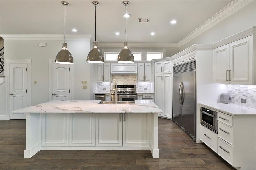 Nestled in Fort Worth’s coveted 76107 zip code, this beautifully updated home blends sophistication, comfort, and convenience just minutes from River Crest Country Club and north of Camp Bowie Boulevard. Built in 2007, the thoughtfully designed floorplan features a welcoming living room with gas log fireplace, built-ins, and sliding doors opening to one of the several private courtyards for seamless indoor-outdoor living. The expansive kitchen is ideal for entertaining with a massive island, quartz countertops, gas range, and built-in refrigerator. The first-floor primary suite offers a serene retreat with courtyard access and a luxurious marble bath featuring a jetted soaking tub, separate shower, dual vanities, and custom closet with direct access to the main floor laundry room. Upstairs includes two ensuite bedrooms both with walk-in closets, a secondary living area, and additional laundry room with an additional versatile closet or work space. Recent 2023 updates include main level wood flooring, fresh paint, quartz surfaces, designer lighting, all new PEX plumbing, while the oversized two-car garage features epoxy floors, custom cabinetry, and equipped with a generator hookup outlet.