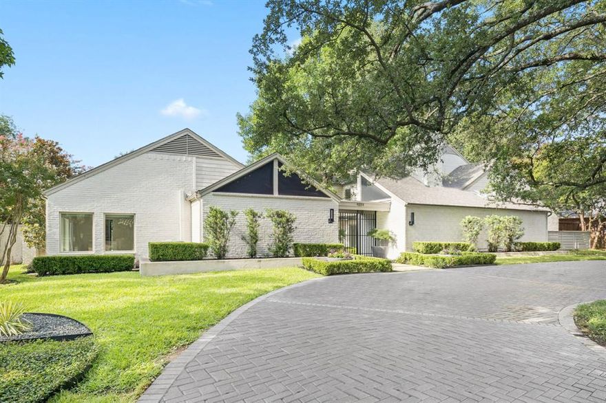 From the gated front courtyard to the lush backyard retreat, this home is a one-of-a-kind masterpiece crafted for everyday luxury and effortless entertaining. Thoughtfully reimagined and impeccably styled, every inch of this residence reflects custom detail and timeless design. Inside are five spacious bedrooms—two downstairs and three up—each offering large walk-in closets and beautifully appointed en-suite baths with unique, high-end finishes. The serene primary suite is a true retreat, featuring separate his and her bathrooms, a cozy sitting area with courtyard views, and generous storage throughout. Vaulted ceilings elevate the living areas, game room, and study, while floor-to-ceiling wide-plank white oak floors create warmth and sophistication. The heart of the home is an extraordinary kitchen with rift-cut white oak double islands, Sub-Zero fridge and freezer, Viking range, JennAir steam oven, plumbed coffee bar, and storage at every turn. The centrally located wet bar includes a Scotsman ice maker, wine fridge, and custom wine storage—perfect for entertaining in style. Lutron electronic shades, tankless water heater, and a 3-car garage add modern convenience. Outside, a private oasis awaits with a sparkling pool, spa, covered patio with outdoor kitchen and turfed side yard—all surrounded by beautifully landscaped grounds. A rare and refined offering in the heart of Northwood Hills.