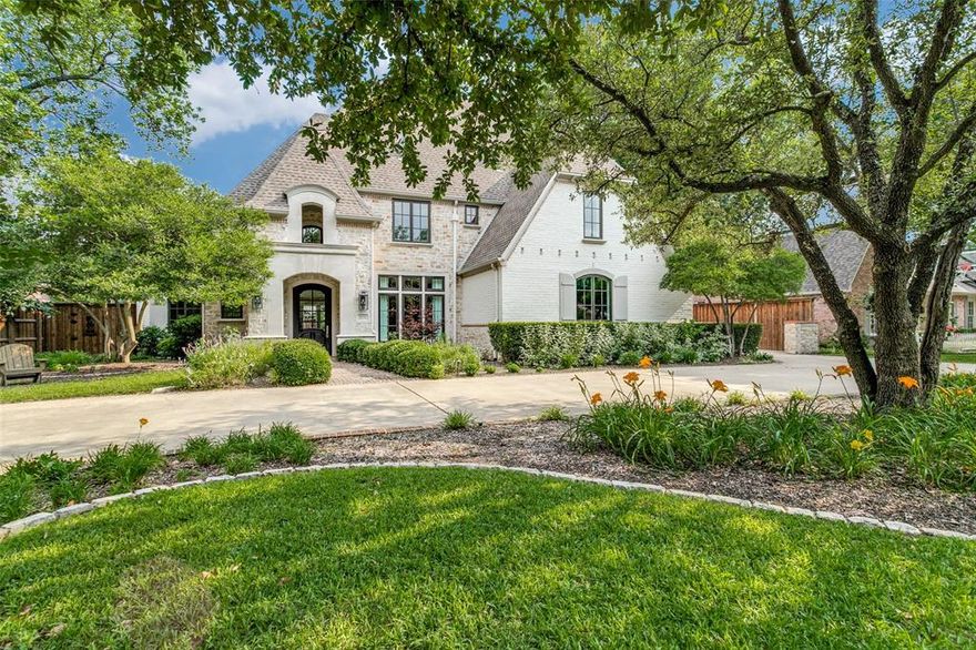 Extensively remodeled in 2020-2021, this home has it all! Refinished hardwoods throughout, high ceilings, Pella windows and doors throughout. Updated kitchen with beautiful cabinetry and top-of-the-line appliances including Subzero refrigeration, a Wolf induction cooktop, additional refrigeration drawers, large center island and wet bar. Office with a private patio and views to the lush landscaping. The living room with fireplace and  French doors, high ceilings, and a fireplace overlooking the tranquil backyard. The primary suite is private with views to the outdoor area and a large walk-in closet. A spa-like bathroom is a showstopper with his and her vanities, gorgeous countertops and a stunning shower and freestanding tub. Adjacent is a coffee bar with refrigeration. Five additional bedrooms on the second level and large game room. Two utility rooms. Pool, spa, Mohave turf, outdoor grill. Three car garage plus circular driveway.