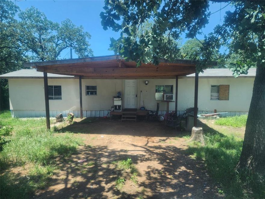 1.91 acres located right off FM 917 only minutes from Burleson. Joshua and I 35W.  This 3 bedroom 3 bath single wide mobile home has been partially remodeled. Each bedroom has it's own full bath. The main bedroom has it's own separate entrance. There are 3 separate carports, one is enclosed. With some finish work this home would make a great rental or temporary place while you build