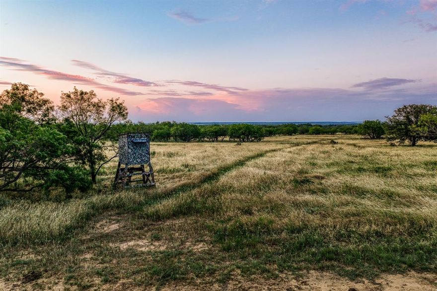 MOTIVATED SELLER!!!    Welcome to the 7L Ranch! Nestled in Lost Valley, Jack County, Texas, this stunning property offers breathtaking views and endless starry nights, just 14 miles from Jacksboro and 1.5 hours from Fort Worth. Ideal for hunting, fishing, horseback riding, and peaceful retreats, 7L Ranch features dramatic elevation changes, oak-covered ridges, and expansive views.

The ranch is 70% wooded with well-maintained roads and trails. A newly constructed lake with a picturesque island is perfect for gatherings, equipped with electricity for camping. The property includes six ponds, seasonal creeks, and abundant wildlife, including deer, turkey, dove, and hogs. A 2BR, 2BA home offers privacy and comfort with spacious living areas and covered porches. Enjoy campfires and stargazing at 7L Ranch, a haven for outdoor enthusiasts.  DRONE VIDEO AVAILABLE UNDER HYPERLINK