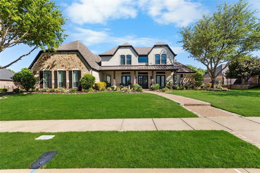 Experience the height of luxury living in Prosper with this exceptional, one-of-a-kind estate—originally designed and built by a custom luxury builder as his personal residence. Showcasing unparalleled craftsmanship, the home has been extensively updated with over $700,000 in thoughtful, high-end renovations, blending timeless elegance with today’s most sought-after finishes. Located within the acclaimed Prosper ISD, this home offers not just a place to live, but a lifestyle defined by excellence. From the moment you step inside, you’re greeted by soaring ceilings and exquisite architectural details including rich millwork, solid-core doors, and designer touches throughout.
At the heart of the home, the fully reimagined chef’s kitchen is stunning—featuring an oversized quartz island, custom white cabinetry, a walk-in prep pantry, and top-tier commercial-grade appliances, including a 48-inch Viking dual-fuel range and Dacor refrigerator-freezer. The kitchen opens seamlessly to the inviting family room, highlighted by a custom beamed ceiling and a beautifully updated stone fireplace.
Designed for both everyday living and elegant entertaining, the home also offers formal living and dining spaces, along with a stylish wet bar. The main-level primary suite is a true retreat, complete with bay windows overlooking the private backyard and a spa-inspired bath featuring dual vanities, a soaking tub, and a custom steam shower. A dedicated office with exterior access provides the perfect work-from-home setup.
Step outside to your own private resort. The expansive covered patio, complete with a third stone fireplace, creates the ideal setting for year-round gatherings. The remodeled heated pool and spa—with a tranquil waterfall feature—serve as the centerpiece of the freshly landscaped lush backyard, surrounded by mature trees for added privacy.
This a statement home located in the prestigious Gentle Creek Estates community.