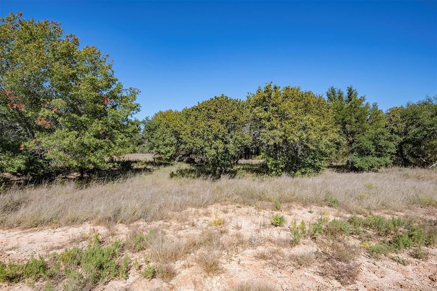 Come see this amazing 2-acre, corner lot in beautiful Glen Rose, TX. The perfect place to build a custom home. This neighborhood is fairly new, and the lot offers lots of privacy with its many trees and an already cleared area ready for building. Water and electric are at the road. Minimal building restrictions include no mobile homes and a minimum of 1600sqft for a home.