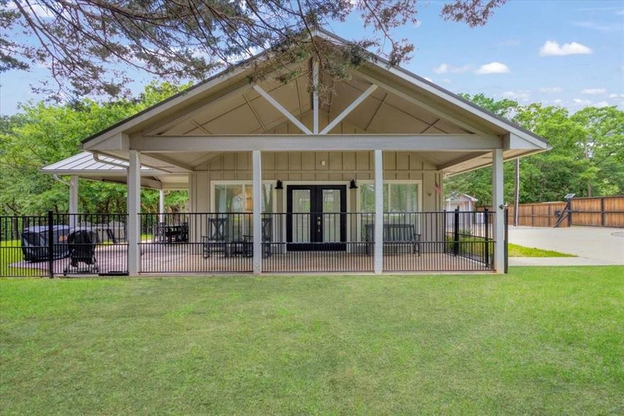 Custom-built modern lake retreat just minutes from Lake Texoma! This beautifully designed and recently updated 1 bedroom, 1 bath home sits on approximately half an acre and offers a rare blend of style and indoor-outdoor living. The open-concept living area features vaulted ceilings, abundant natural light, and a full glass garage door, with an electric screen that opens seamlessly to the covered outdoor living space—perfect for entertaining or relaxing in nature.

High-end finishes throughout include custom cabinetry, a kitchen with plenty of counter space, gas oven, power shades, indoor-outdoor surround sound, a spa-inspired bathroom, soaking tub, tankless water heater, spray foam insulation, and thoughtful design details that maximize comfort and efficiency. Step outside to enjoy the expansive yard, outdoor shower, outdoor living area with a gas fireplace, a peaceful wooded setting, and its all within close proximity to Lake Texoma, marinas, and local recreation.

Ideal as a weekend getaway, full-time residence, or short-term rental investment. The dual power gated entry provides added privacy, with plenty of room to expand or personalize the property. A unique opportunity to own a low-maintenance, luxury home near one of North Texas’ most popular lake destinations. This property includes 5 lots with access from Cameo St as well. Ask about additional lots available. Come see why families love Living on Lake Texoma