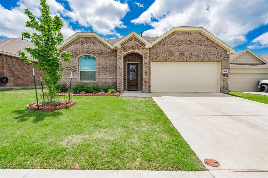 Situated on a 0.15-acre lot, this 1,847 sq ft home built in 2023 offers a thoughtfully designed layout that blends comfort and functionality in one of Fate’s growing communities. Step into a welcoming living room filled with natural light and an open floorplan that creates an inviting space for relaxing or entertaining. The eat-in kitchen sits at the heart of the home with stainless steel appliances, a large island ideal for hosting or busy mornings on the go, abundant cabinetry, and generous counterspace designed for everyday living. The spacious primary bedroom provides a comfortable retreat with a private ensuite bath designed for convenience and relaxation. Additional bedrooms are well-sized and versatile, offering flexibility for guests, hobbies, or workspace. Outside, a generously sized backyard provides plenty of room to unwind, entertain, or enjoy quiet Texas evenings. Located just minutes from Lake Ray Hubbard and the shopping, dining, and entertainment of nearby Rockwall and an easy commute to Dallas, this home offers the perfect balance of suburban comfort and city accessibility in a rapidly growing area. Proudly Claim Your Piece of Texas!