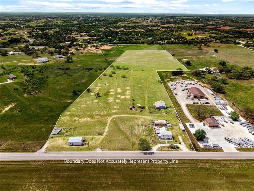 18.46 Acres outside of Weatherford city limits. COMMERCIAL POTENTIAL. UNRESTRICTED . TXDOT REPORTS 3,794+ VEHICLES 
TRAVEL THIS ROAD DAILY. This property is currently a super cute small cattle ranch. The home is cozy and has a cowboy flair.
There are french doors leading from the living area to the large covered porch that is perfect for your family and friends BBQ's. The kitchen has a long breakfast bar and enough size for a table that can seat 12. The master is cowboyed up with a brick wall with a fireplace for extra cozy nights. There is ample parking for your vehicles, trailers and recreational vehicles as well as RV parking and hookups. You can make it your new home or live in it while you build a larger home or perhaps the emphasis would be to change the use of the land to use for industrial or commercial purposes. What ever you choose it is an ideal location. The property next door is a 5 acre Horse Trailer Lot and the property that just sold on the other side of it is set up to be small Industrial park. The property is flat and fenced and cross fenced and has a barn and a 24x42 workshop with 220 electric
and water.
