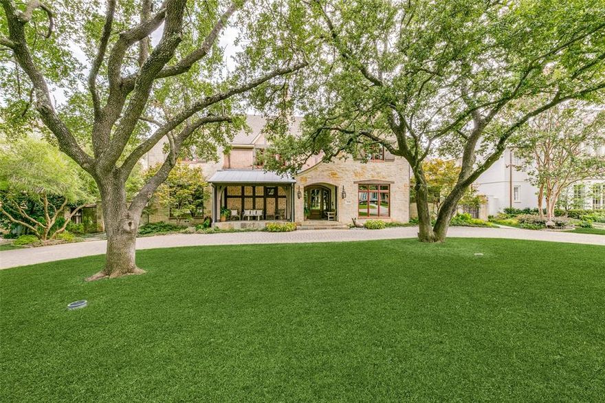 PRICED TO SELL!  Nestled in the Fairway of University Park, this timeless custom 2013 Tudor offers a relaxed yet elegant aesthetic on a prime oversized 100' x 150' heavily treed lot.  This inviting open floor plan offers a sophisticated freshly painted interior bathed in natural light throughout.  Highly sought after FIRST FLOOR PRIMARY SUITE with dual vanities and his-her walk-in closets. Soaring 14' beamed ceilings in Great Room, a striking floor to ceiling herringbone fireplace, a wall of large scale windows and rare 7 in wide plank reclaimed pine floors set the stage for this gracious home.  Two spacious dining rooms adjoin the gourmet kitchen with a premium Thermador appliance package.  The Second floor includes 4 Bedrooms, one of which could easily serve as play room, and a generous climate controlled storage room.  A masterfully designed outdoor living area includes a grilling station, outdoor fireplace and ample gathering space overlooking a lush landscaped backyard.