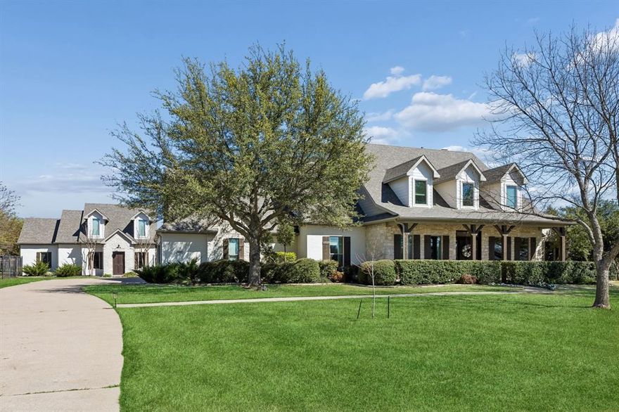 Experience the pinnacle of Lucas living in this meticulously maintained estate within the prestigious Lovejoy ISD. The main house and guest house combine for 4,955 sq ft of turn-key luxury on a sprawling 2 acre lot. The main residence has been thoughtfully updated in nearly every space, featuring an open concept living area, remodeled chef’s kitchen, designer bathrooms, fresh paint and refinished floors. The functional floor plan includes two convenient first-floor bedrooms, two living and dining areas, a media room and a dedicated office. Significant investment was made with new Anlin windows (2023), new exterior paint and professional landscaping. A 240V EV charger was added to the oversized 3 car garage. The versatile guest house features 1 bedroom, 1 bath, and two living areas. With its own private front door entrance, this secondary dwelling has the perfect footprint for a professional home office or guest retreat. The outdoor oasis is built to entertain, centered around the sparkling pool that has been refinished and updated with a new heater, pump, and smart home automation. Beyond the pool area, the massive, fully fenced backyard offers privacy and opportunity. Comprehensive upgrade list available upon request.