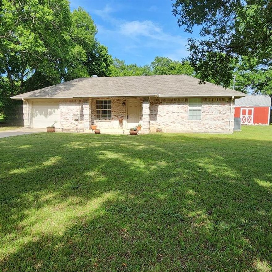This Cozy Home is back on the market! Don't miss your chance to own this piece of Texas small town life.
A Perfect Blend of Comfort and Space. Welcome to this charming home, ideal for small families or anyone looking for a comfortable environment to experience small town life. Situated in a tranquil neighborhood, this delightful three-bedroom, 1 ½-bathroom home provides the perfect living space on a generous 0.45 acre tree lined lot. You'll enjoy a serene environment while having plenty of room for outdoor activities including a vegetable garden, allowing you to grow your own produce., or entertaining with plenty of room for your toys and to play. This home offers a harmonious combination of cozy interiors including a welcoming living area with plenty of natural light, creating a warm and inviting atmosphere for relaxation or entertaining guests. The functional kitchen is thoughtfully designed, providing ample counter space and storage to meet all your culinary needs. The home includes three comfortable bedrooms, perfect for family members or guests. The 1 ½ bathrooms are conveniently located and updated for modern functionality. An 8 ft by 16 ft storage shed provides additional space for tools and equipment, while the one-car garage adds convenience for parking or storage. Located close to local amenities, schools, and Lake Ray Roberts recreational facilities, this home provides the perfect balance between a quiet lifestyle and accessibility to everyday needs. Don’t miss out on this unique opportunity! Call us or your agent to schedule your private showing today and discover the charm and potential of this wonderful home. The current FEMA Flood Map appears to show the home is currently not in a flood plain. See attached copy of FEMA Flood Map or go to the Flood Map tab to view. All information is deemed to be reliable. Buyer and Buyer's Agent are responsible for confirming all information. Subject to lease with closing & possession 30-45 days after option period.