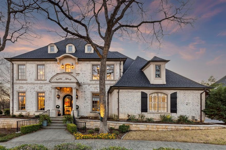 Strategically situated on a large corner lot just a stone's throw away from the guard gated entrance to Hogans Glen sits 1 Hayes CT. This beautiful French inspired chateau is truly one of a kind! Stunning views in all directions! Look for lovely stone bridges, ponds with fountains nestled against the backdrop of the Hogans Glen Golf Course, amazing oak trees, and of course the Resident Geese! This house has been thoughtfully renovated. Since the home's strong bones and architectural detail were already present, much consideration was given to just simply re-creating its original beauty in a more current fashion to make her a grand lady once again!  The circular cobblestone driveway leads to a stunning arched entry door, elegantly crafted with custom made iron and glass. Upon entering, guests are greeted by an impressive iron circular staircase, slate floors and a high end glass & chrome sputnik chandelier. The dining room, now an elegant piano room, is bathed in natural light from the multiple custom windows. The kitchen boasts every amenity desired for hosting the perfect dinner party, including high-end appliances, a pot filler, warming drawers, under counter refrigerator and a wine cellar. The secluded primary suite offers patio access and features a spacious walk-in shower, dual vanities, a whirlpool tub, and his-and-hers custom closets. Upstairs, is a sprawling game room, a stadium-style media room, and a balcony overlooking the pool. This home is absolutely stunning—a true must-see!