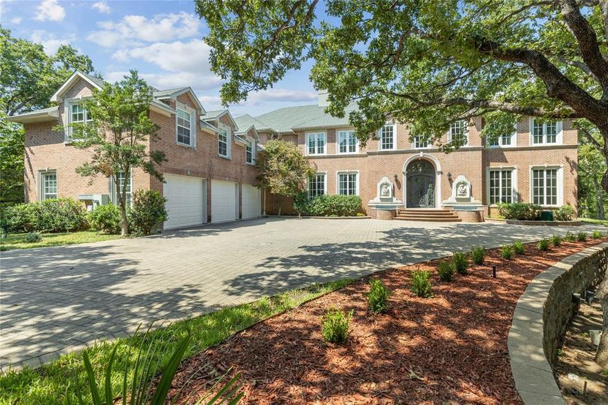 Magnificent Estate just minutes away from the best that Arlington has to offer.  An Entertainers Dream featuring elegant wood floors, several cozy fireplaces, En suites and private sitting rooms.  The spacious kitchen is a chef’s delight with an island breakfast bar, ample cabinetry and countertop space, perfect for gatherings of any size. The home also boasts a library, multiple bars, a fully equipped game room. an indoor sports recreation room and an outdoor sports court.  This estate is privately gated with 1.5 acres of meticulously landscaped grounds, serene walking paths, & a luxurious pool with fire and water features.  Newly added upgrades and ample storage are just some of the bonuses included. This home truly radiates timeless charm and luxury. Whether you're dreaming of lavish parties, corporate retreats, or simply enjoying the grandeur of this stunning property, it’s a must-see for those seeking luxury and endless possibilities in Arlington’s most coveted location.