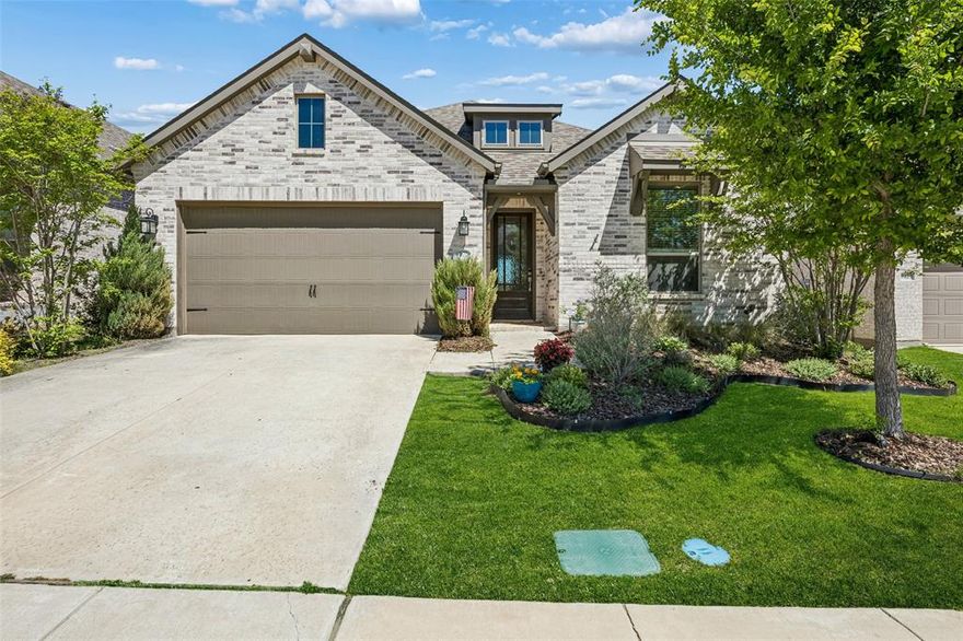 Beautifully designed one-story home featuring a versatile floorplan filled with abundant natural light. Offering 4 bedrooms, this layout provides flexibility for a home office, guest space, or additional living area to suit your needs. The spacious primary suite is a true retreat, highlighted by a charming bay window that brings in soft light and serene views. Built by highly regarded Highland Homes, this property reflects exceptional craftsmanship and attention to detail throughout.

An added benefit is the assumable VA loan, presenting a unique opportunity for qualified VA buyers. The outdoor space is equally impressive, with a lush, thoughtfully landscaped yard featuring four Chaste Trees (Vitex agnus-castus). These trees create beautiful shade, vibrant seasonal blooms, and attract butterflies, birds, and other pollinators, enhancing the peaceful, nature-filled setting. Enjoy unobstructed sunrise and sunset views from the backyard, making it a perfect place to relax and unwind.

The home offers a tranquil atmosphere and is just a short nature walk to the lake, ideal for outdoor enthusiasts. Located in the amenity-rich Wildridge community, residents enjoy access to two resort-style pools, miles of scenic hiking and biking trails, three catch-and-release ponds, and a variety of community events. Lakeside access to Lake Lewisville includes canoes, kayaks, and paddleboards available for resident use.

Schedule your private showing today and experience all this exceptional home has to offer.