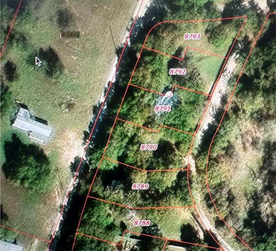 Check out this property near Lake Proctor.  It is partially located in the U.S. Army Corps of Engineers flowage easement.  Six lake lots are included in this 1.30 acre parcel.  The property features a single wide mobile home and a guest house or man cave.  There are three portable carports and an above ground pool.  Also included are three septic tanks, a shop, and three entrance gates.  The entire grounds are currently fenced.  The lots have the potential to be utilized as RV spaces.  There are many trees on this property.  Don't miss the opportunity to make this your peaceful retreat.