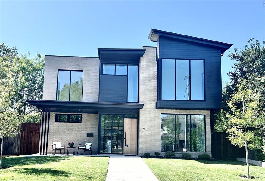 Experience sophisticated luxury in Dallas’ sought-after Little Forest Hills. This generous home showcases expansive windows, filling the space with natural light. A brick facade seamlessly extends from the exterior into the entryway, accented by a striking steel staircase with white oak treads. The gourmet kitchen impresses with Fisher and Paykel appliances, quartz countertops, a wine fridge, and a spacious island flowing into the living and dining areas, plus a well-appointed walk-in pantry. The downstairs primary suite provides a tranquil escape with a sizable walk-in closet and a refined bathroom featuring a large shower and tub. Upstairs, three additional bedrooms include one with a private en-suite, complemented by two adaptable spaces ideal for a game room, office, or fitness area. A study overlooks the front yard, while the outdoor area charms with a generous covered patio, board-on-board fencing, and a motorized solar-powered gate. Convenient laundry facilities are located both upstairs and in the primary closet.  Large storage closet adjacent to half-bath in lieu of attic space. 

LOCH Custom Homes backs this residence with a 10-year structural, two-year mechanical, and one-year workmanship warranty.