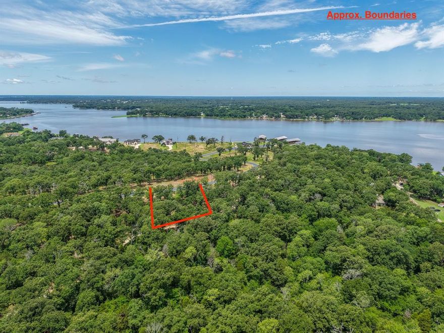 Beautiful elevated 1.63 acre lot with boatslip #29 and within walking distance of the community boatslips, clubhouse and pool. Cedar Creek Ranch is recently developed upscale gated community with 82 lots varying in size from 1 to 6 acres. Restricted to site built homes minimum 1600 HVAC living space. Build your dream home in this private gated subdivision with fabulous community amenities to enjoy the lake lifestyle. Fences must be iron, aluminum or wood not exceeding 5 ft. HOA fee gives full use of boat launch ramp and clubhouse with workout facility, kitchen, meeting room, and pool. Rentals minimum 3 days unless a shorter amount of time approved by the HOA. Deeded boatslip #29.