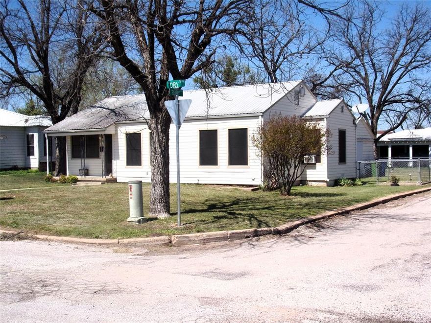 This cute little 3 bedroom 1 bath is a perfect starter home or a great investment opportunity. It has been recently updated with new light fixtures, hardware, flooring, paint, new bathroom cabinet and new subway tile around the tub shower combo. It also has two window units and two wall heaters. You will love all the natural light this property has to offer. The hardwood floors are beautiful. Enjoy entertaining in your large sized backyard. It could have a really cute curb appeal as well by adding a few flowers and bushes. There is also a garage and this is where you find the washer and dryer hookups. Don't miss this opportunity as nice move in ready houses at this price are hard to come by here is San Saba. Call me Today and let's connect.