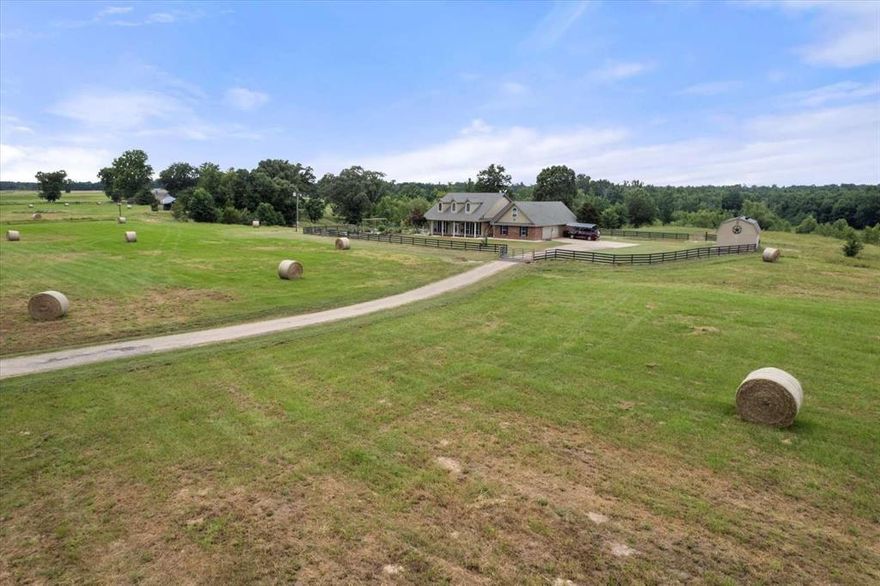MOTIVATED SELLER! 57-acre ranch-farmstead with 4-bed, 2.5-bath home (2,312 sq ft). 10 minutes from Mount Vernon and Winnsboro with easy access to the lake. 3,160ft of road frontage on SW 3230. Stunning views from the large veranda, mature pecan trees, productive hay pastures, and spring-fed ponds. The property is completely fenced. Motorized entrance gate. In-ground storm shelter added in 2023. Wealth of amenities, including a pole barn, workshops, two extra large chicken coops, and an expansive herb garden with more chicken coops. Whether you're looking to embrace a self-sufficient lifestyle, run livestock, or simply enjoy the peace and quiet of nature with amazing sunsets, this property has it all! Make this your turn-key haven; farm equipment and livestock are negotiable and can convey. Excellent hunting for deer and wild hogs.