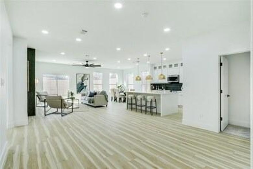 Modern One-Story Stunner in Booming West Dallas — Walk to the $1B Soho Square Lagoon
Welcome home to a 2023-built, 4-bed, 3-bath contemporary single-story tucked in one of Dallas’s fastest-rising neighborhoods. Step through a dramatic 12-foot entry into an open-concept living space with 9-foot ceilings, luxury vinyl plank flooring, and natural light pouring in from every angle.
The chef’s kitchen is the showstopper — quartz countertops, a bold black-and-gold backsplash, European cabinets with glass uppers stretching to the ceiling, walk-in pantry, and an oversized island made for entertaining. Two fireplaces (yes, two — including one in the primary suite) add warmth and elevated style.
The primary retreat features a spa-worthy bath with a floating dual vanity, freestanding soaking tub, frameless glass shower, and a generous walk-in closet. Three additional bedrooms — all with walk-in closets — give you flexibility for family, guests, or a home office.
Step outside to a fully fenced backyard with an 8-foot cedar privacy fence, mature trees, and a covered patio perfect for Texas evenings. NO HOA.

Location wins:
        •       6 miles to Dallas Love Field, Parkland, UTSW, and Children’s Medical
 • Quick access to I-30 & Hwy 12
 • Walking distance to the $1 Billion Soho Square Lagoon mixed-use development — West Dallas’s next major appreciation driver
 • Minutes to Trinity Groves, Bishop Arts, and Downtown Dallas

This is new construction without the wait, in a neighborhood about to explode. Schedule your private showing today.