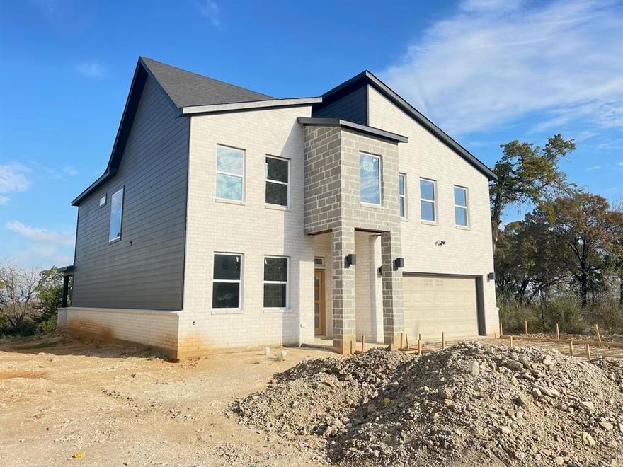 Great opportunity to own a new construction single family home on a huge lot. This home is part of a new development with six other homes. With an open floor plan, spacious kitchen island and pantry, this new home has a contemporary modern style. It also features an electric fireplace in the living room, double vanity in the master bath, walking closets on all bedrooms, tile and carpet throughout the house, and lots of storage with a huge mud room and various closets.