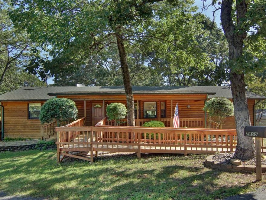 ALL OFFERS CONSIDERED…MOTIVATED SELLERS!! Discover the ultimate Lake Fork lifestyle with this charming log-façade lakefront retreat, perfectly positioned on open water with breathtaking views and direct access to world-famous fishing. Located on a .5-acre deeded lot with an additional 1.12 -acre SRA leaseback, this property is a rare gem combining natural beauty, comfort, and convenience. The well-maintained 3 -bedroom, 2-bath home features a spacious living area that flows effortlessly into a generous kitchen and oversized breakfast nook—each offering expansive lake views. The kitchen boasts granite countertops, ample cabinetry, and a cozy breakfast bar. Aspen wood paneling adds warmth and character throughout. Designed with accessibility in mind, this home features an ADA-compliant front ramp, wheelchair-friendly layout, and a motorized lift off the back porch. The main bathroom includes a Safe Step Walk-In Tub, installed in 2024. Additional upgrades include a furnace and heat pump replaced just three years ago. Outdoor living takes center stage with three patios, a glassed-in sunroom with its own large deck, and a screened gazebo perfect for year-round enjoyment. A misting system ensures comfort around the home, carport, and gazebo. The backyard is fully fenced and includes a concrete entertainment space. Two metal carports and a circular front drive provide ample room for boat, trailer, and RV parking, with an asphalt driveway extending to the lake. The 150'+ boathouse includes a single slip with boat lift, covered sitting area, cleaning station, ceiling fans, storage, and utilities…all under a durable metal roof. The 40' open pier leads to water approximately 10 feet deep at the end and 9 feet at the slip—ideal for anglers. Centrally located with easy highway access to all Lake Fork hotspots, this property blends comfort, accessibility, and outdoor recreation into one exceptional lakefront retreat.