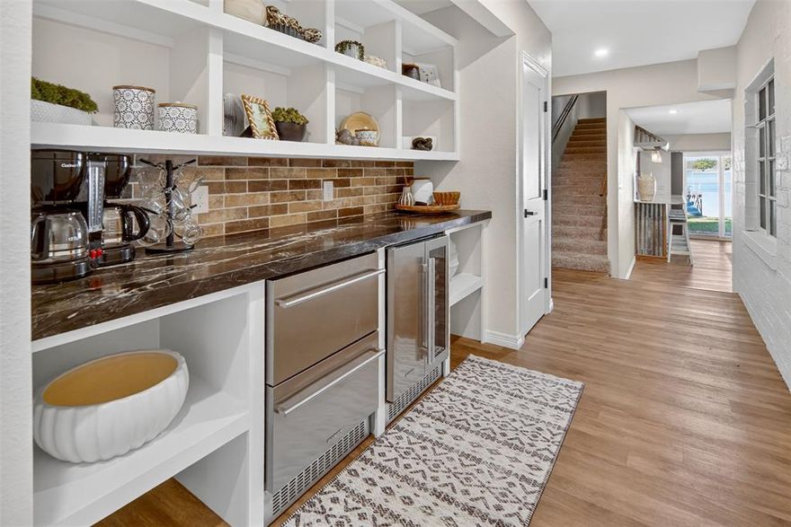 LISTING NOW INCLUDES 2400 SQUARE FOOT NEW BOAT BARN, on second lot that's 0.272 acres, conveniently across the street from your new lake home. Finished out and plumbed if you'd like to convert it into more living space, it's also climate controlled! Both are on a quiet road and the main house sits on the pristine shoreline of Possum Kingdom Lake. Main house is remodeled, comes furnished, turn key and ready for you to enjoy. Enjoy a setting with mature trees that provide shade and enhance the ambiance while taking in some of the absolute best sunsets you've ever witnessed. Flat, level lots with St. Augustine grass feels great on your feet as you dip your toes in the water, or drop a line for the big catch of the day! Swim dock and walkway really add to the lake front experience. This special, meticulously well maintained property is literally everything what you'd want in a lake home, and more! The entire upstairs is a huge, primary suite complete with sitting area which can double as an office with a view! The primary bath and huge walk in closet are what dreams are made of, truly spectacular! You'll enjoy the black out electric shades that keep your home cool in the summer and can't help but assist in the best night's sleep. Outdoor shower really comes in handy, every lake home should have one!  Located on the highly sought after Peninsula, you're very close to many options for dining, live entertainment and shopping. Possum Kingdom Lake, also known as the Great Lake of Texas is not only scenic, but offers all the fun boating, surfing, fishing and floating fun one would want. You'll be in awe of the 200 foot bluffs and topography, it's a magical place that will keep you coming back for more.