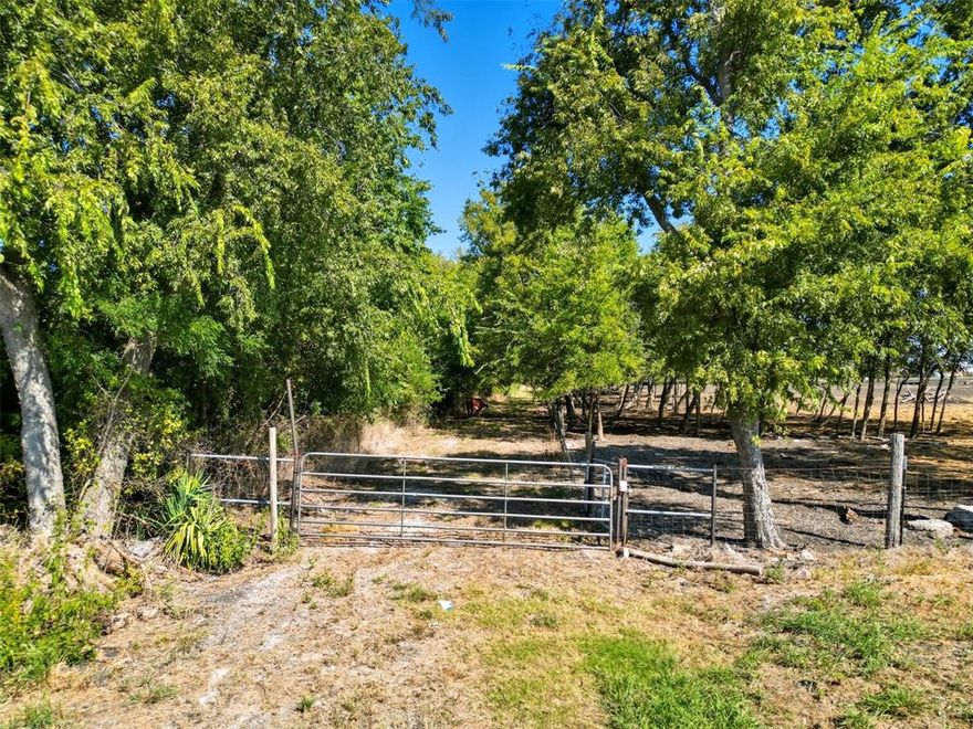 Hunter’s paradise just 7 miles north of Greenville off Highway 34! This 13.564-acre tract is mostly heavily wooded, offering abundant wildlife, natural privacy, and a peaceful rural setting. A seasonal creek runs through the property, adding natural character and attracting wildlife. There is a clearing near the front that the seller indicates could be suitable for a future homesite outside the floodplain. Property has direct frontage on FM 3427, with access through a gated entry — the gate is the only visible frontage from the road. Approx. 30–40% of the land lies in FEMA Zone A floodplain — buyer to verify. No HOA, no MUD, and no known restrictions.

The seller is also leaving a travel trailer on-site, located in the cleared area — a great option for weekend stays or staging during future development. Perfect for hunting, weekend getaways, or creating a quiet, secluded place to call home.

All information deemed reliable but not guaranteed. Buyer and buyer’s agent to perform their own due diligence regarding floodplain, utilities, easements, and all property details.
Note: Seller currently allows a neighbor to graze cattle on the property by permission only. Livestock will not be included in the sale, and no formal lease will convey.