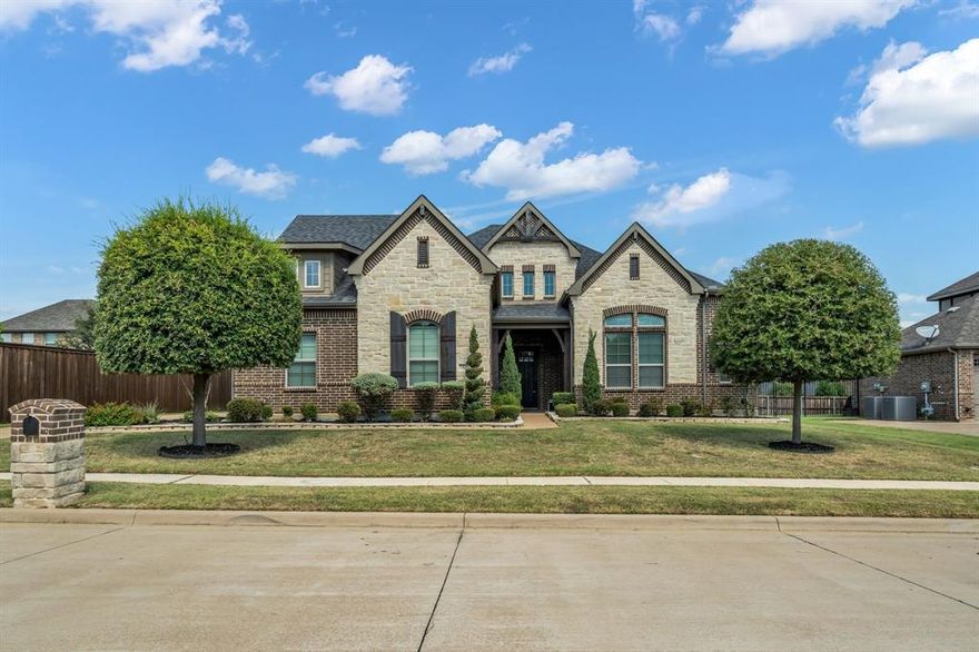 Priced below market value in the prestigious gated community of Calender Crossing.  This John Houston Custom Home is both stunning and well maintained.  It features 4 bedrooms, 2 full baths, 1 half bath and located in the Mansfield ISD.  One bedroom can easily be converted to a home office. This thought out design includes an open floorplan with modern designs and a split bedroom arrangement.  It also offers a massive formal dining area, arched entryway openings throughout, tray ceilings and many other luxurious finishes.  This state of the art kitchen offers a spacious kitchen island, granite countertops, stainless steel appliances, brand new microwave, gas cooktop, deep soaking sink, knotty alder custom cabinets, walk in pantry, eat-in area and is open to the family room which features a beautiful stone gas log fireplace with mantle.  As you enter the master suite you will find that it is very spacious and leads into a master bathroom that has two vanities, separate shower with a sitting bench and a huge walk-in closet.  The floor print of this home is versatile and can fit a variety of lifestyles.  Let's not forget this home also offers an oversized 3 car garage and plenty of additional outdoor parking in the enormous driveway.  Exterior features host a beautiful curb appeal which includes a well maintained landscaped yard, trees, covered front porch, extended back patio, wrought iron fence that separates the side yard from the driveway and plenty of space for those outdoor gatherings.  Location is ideal and nestled in a gated community close to shopping and major highways.  Schedule your private showing today. Updated repairs that have been completed include - AC units serviced 9-18-25, Carpet professionally cleaned 9-26-25, Roof repairs, Irrigation and Electrical also recently repaired. Receipts are located in the document section.