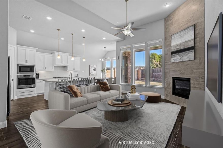 Experience refined living in this stunning two-story corner-lot residence, perfectly positioned with a desirable west-facing orientation. A grand entry welcomes you with soaring ceilings, setting the tone for the home’s impressive scale and elegance. The formal dining room offers the perfect setting for memorable gatherings, while the expansive family room showcases a beautiful floor-to-ceiling tile gas fireplace and seamless flow into the gourmet kitchen. Designed for both everyday living and entertaining, the kitchen features an oversized island ideal for meal prep, gas cooktop and oven, abundant cabinetry, and a sunny breakfast nook. The private primary suite on the first floor serves as a luxurious retreat, complete with a spa-inspired ensuite bath featuring dual vanities, a garden tub, separate shower, and spacious walk-in closet. A secondary bedroom on the main level provides flexibility for guests or multigenerational living. Upstairs, enjoy endless entertainment possibilities with a large game room, dedicated media room, and two additional bedrooms. Step outside to a covered patio overlooking a generously sized backyard with ample space to play, relax, or host unforgettable gatherings. Ideally located with convenient access to multiple highways, premier shopping, dining, and just minutes from University of Texas at Dallas, this exceptional home offers the perfect blend of luxury, comfort, and convenience.