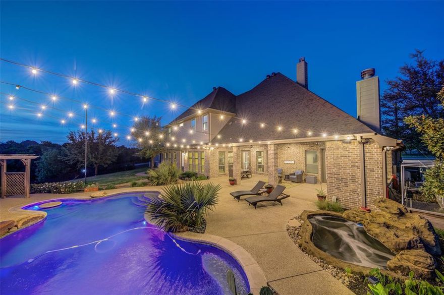 Luxury property with a backyard oasis that will make you never want to leave! Located in the highly sought after Deer Ridge Estates This home boasts 5,083 square feet of living area, 6 beds and 3 & a half baths! Other amenities include a office, gym, game room with pool table, home theater room and  attached 3 car garage! Wood burning fireplace with beautiful exposed beams throughout the first floor of the home! Four bedrooms are downstairs with their own bathroom, the other two are upstairs with jack and jill bath, all bedrooms have walk in closets. Outside, you'll find the backyard oasis with amazing sunset view to the West! The outdoor patio is huge and features a fireplace, tv, built in grill and fans, perfect for summer gatherings around the pool and hot tub! The pool is lighted, cooled and heated and looks like natural stone! The backyard has a mosquito misting system all the way around and also a custom raised garden for your veggies! The property has a 2nd garage that is 1272 square feet, the perfect man cave, heated and cooled, granite countertops, fridge, car lift & extra parking! From the backyard you'll walk down the solar lighted steps to your lighted private pond with a firepit with automated lights! The shop has it's own entrance off the cul-de-sac for easy access with a concrete wrap around drive plus a private automatic gate! The 30'x60' shop has a overhang for more covered parking or covered entertaining! The shop is insulated, 2 new HVAC systems, epoxy flooring, office area with bathroom and a mezzanine that has extra space for storage or more desk space! Horses are allowed! All this is situated on a partially wooded lot, giving you privacy on 3 acres! No description could do this property justice, so call to view or for more information! Contact agent for the property website link for more photos!