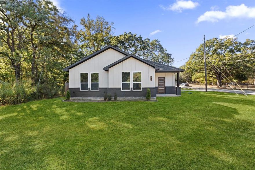 **Seller's preferred lender is offering a 1% lender credit to go towards buyer's closing costs or an interest rate buy down.** 
Beautiful 2023 modern build sits proudly on a corner lot and offers a perfect blend of style, comfort, and convenience—all just minutes from the lake. From the moment you step inside, you’ll love the open layout that makes the home feel bright, spacious, and inviting. It’s the kind of space that feels just right for relaxing with family or hosting friends. The kitchen is truly the heart of this home, featuring sleek modern finishes, stainless steel appliances, and a large island that’s perfect for gathering around. The decorative lighting throughout adds a warm and welcoming touch, giving each room a little personality and charm. The living area is open and airy, filled with natural light that highlights the home’s clean lines and modern design. Your primary suite is a peaceful retreat with a private ensuite bathroom complete with dual sinks, a walk-in shower, -- perfect for unwinding after a long day. The additional bedrooms are spacious and versatile, making them great for family, guests, or even a home office. Outside, the corner lot gives you extra yard space and more privacy to enjoy outdoor living. Whether it’s morning coffee on the patio or a weekend cookout, you’ll have plenty of room to make it your own. And the location couldn’t be better—you’re just minutes from the lake, where you can enjoy boating, fishing, or peaceful walks by the water. Shopping, dining, and everyday conveniences are also nearby, making this home as practical as it is beautiful.