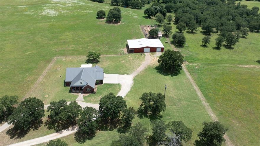 This wonderful 41-acre property has it all.....peaceful country living, hunting, recreation, and farm-ranch capabilities. Conveniently located right off Highway 281, the custom 3-bedroom house has an additional upstairs bunk room that will hold lots of grandkids or visitors! The open floor plan and split bedroom design are complemented by a large bonus room that would make a great second living area or formal dining. Both guest bedrooms offer ample space and share a full bath. A new metal roof was installed June 2024. For the hobbyist or professional, the property includes a 30x53 shop with 2 roll-up doors, an attached 24x27 smaller shop with 2 roll-up doors, a 24x53 attached carport, and 50amp service for RVs. The large stock tank is fed by a 75 ft solar well, so there's always water for the livestock. There are lots of extras that make this property special like a fenced garden area with raised beds and a drip water system, a greenhouse, a chicken coop, a tankless water heater, a storm shelter, and a 375 ft water well that produces naturally soft water. An additional 39 acres with a home, barn and working pens may also be purchased. See MLS 20816233 for additional property and MLS 20816341 for entire property with 80 acres and 2 homes.
