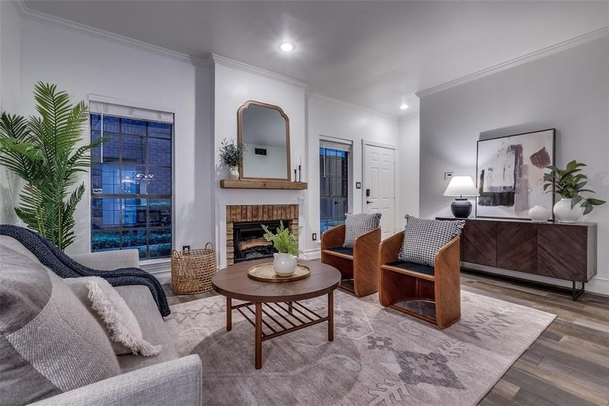 Updated 0ne-bedroom condo in the heart of Oak Lawn that is in walking distance to many shops and restaurants. This well maintained complex boasts a nicely landscaped courtyard and perimeter security fencing from the street. The living area includes a wood-burning fireplace. The kitchen is complete with stainless steel appliances and features a large window overlooking the patio that allows natural light. The updated master ensuite boasts floor-to-ceiling built-in cabinets and leads out to your oversized private patio. The ensuite bathroom features updated tile floors and a spacious walk- in shower.  The unit comes with one covered parking space. Recent upgrades includes a tankless water heater and HVAC.