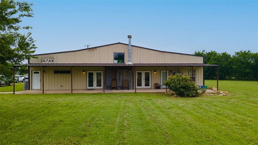 Set on 3 fully fenced acres, this beautifully crafted custom barndominium offers the perfect blend of country living and modern comfort. Surrounded by mature trees and situated on flat, usable land, the property provides endless opportunities to build a barn, shop, arena, or create your ideal setup for horses and farm animals.

Inside, the home features cathedral ceilings and is exceptionally well insulated, creating an open, airy feel with energy efficiency in mind. The spacious kitchen is a standout with a split island design, farmhouse sink, double ovens, and a 6-burner gas cooktop—perfect for entertaining or everyday living. Durable stained concrete floors run throughout, combining style with easy maintenance.

Designed with flexibility and accessibility in mind, the home includes wide ADA-compliant doorways and a private mother-in-law suite complete with its own entrance, space for a refrigerator and oven, a full bath, and a walk-in tub—ideal for multigenerational living or guest accommodations.

With three full bathrooms, thoughtful upgrades, and plenty of room to expand, this property offers a rare opportunity to enjoy peaceful acreage living without sacrificing modern conveniences.